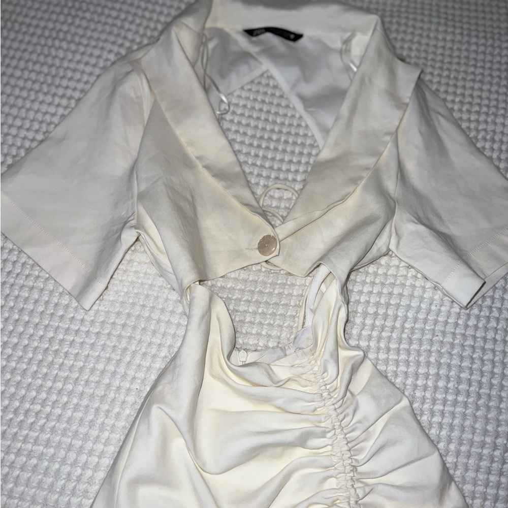 dress with neckline and open back with knot below